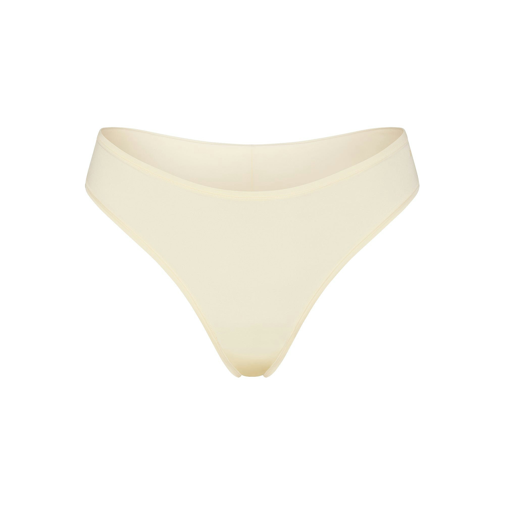 SHINE FOUNDATIONS THONG | BUTTER (THONGS, PANTIES) LAYS FLAT ON A WHITE BACKGROUND | FLT