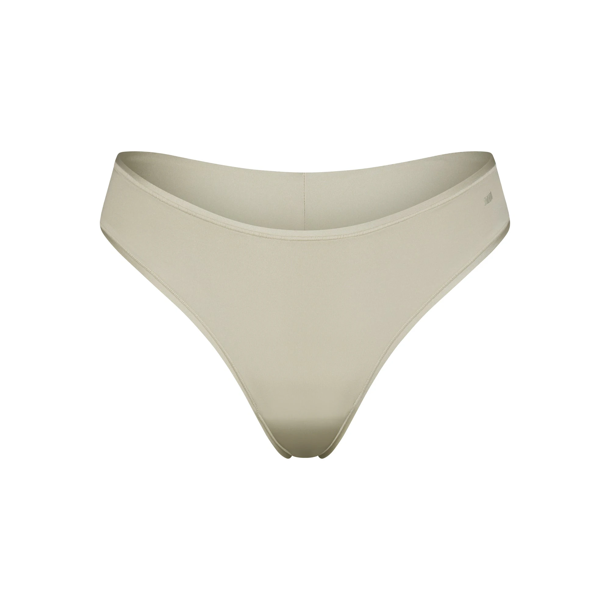 SHINE FOUNDATIONS THONG | TALC (THONGS, PANTIES) LAYS FLAT ON A WHITE BACKGROUND