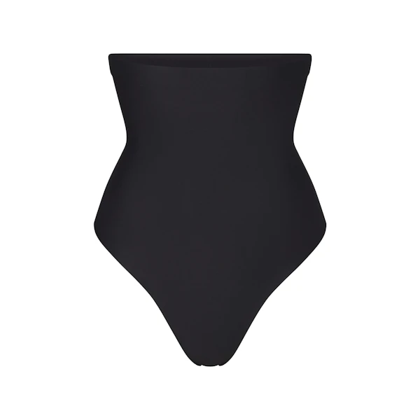 SKIMS BODY HIGH-WAISTED THONG | ONYX (SHAPEWEAR THONGS, SHAPEWEAR) LAYS FLAT ON A WHITE BACKGROUND