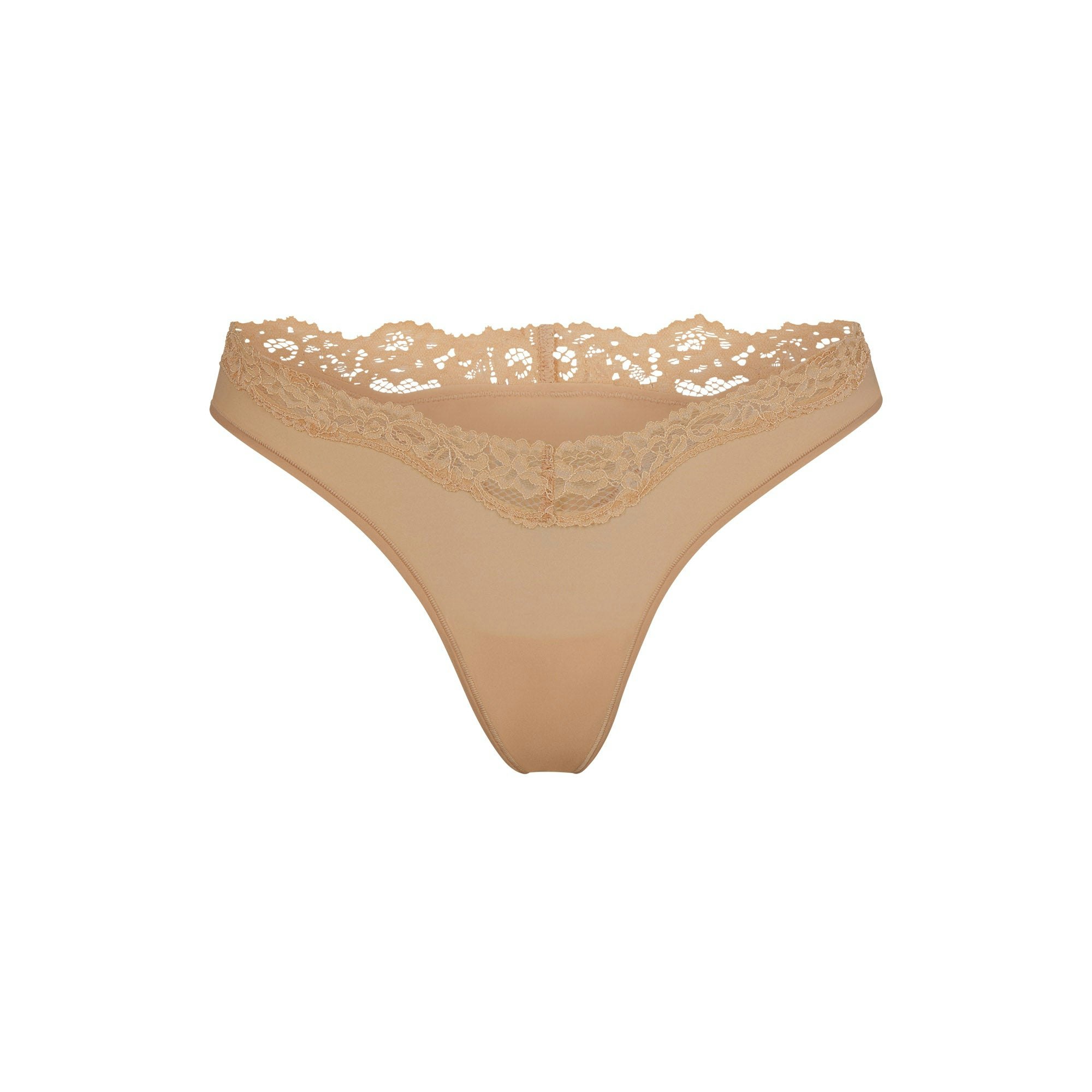 FITS EVERYBODY LACE DIPPED THONG LAYS FLAT ON A WHITE BACKGROUND | FLT