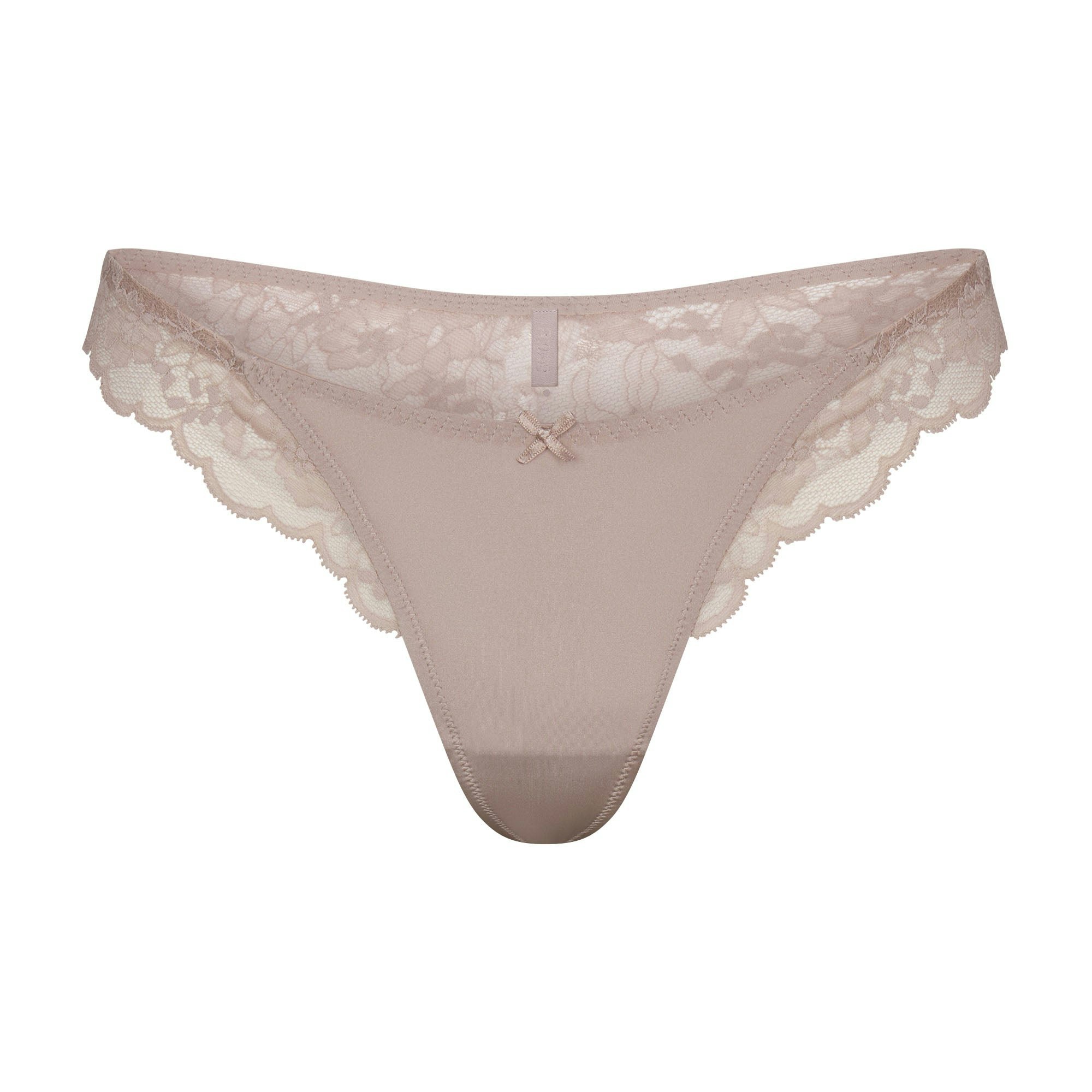 SKIMS LACE THONG | FAWN FLAT ON A WHITE BACKGROUND | FLT