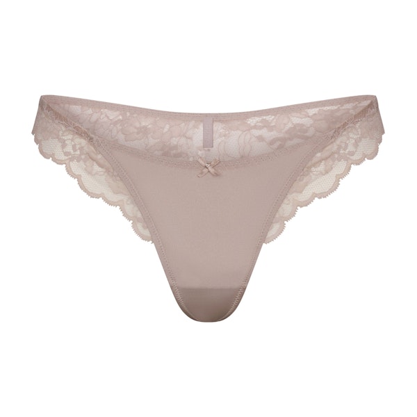 SKIMS LACE THONG | FAWN FLAT ON A WHITE BACKGROUND | FLT