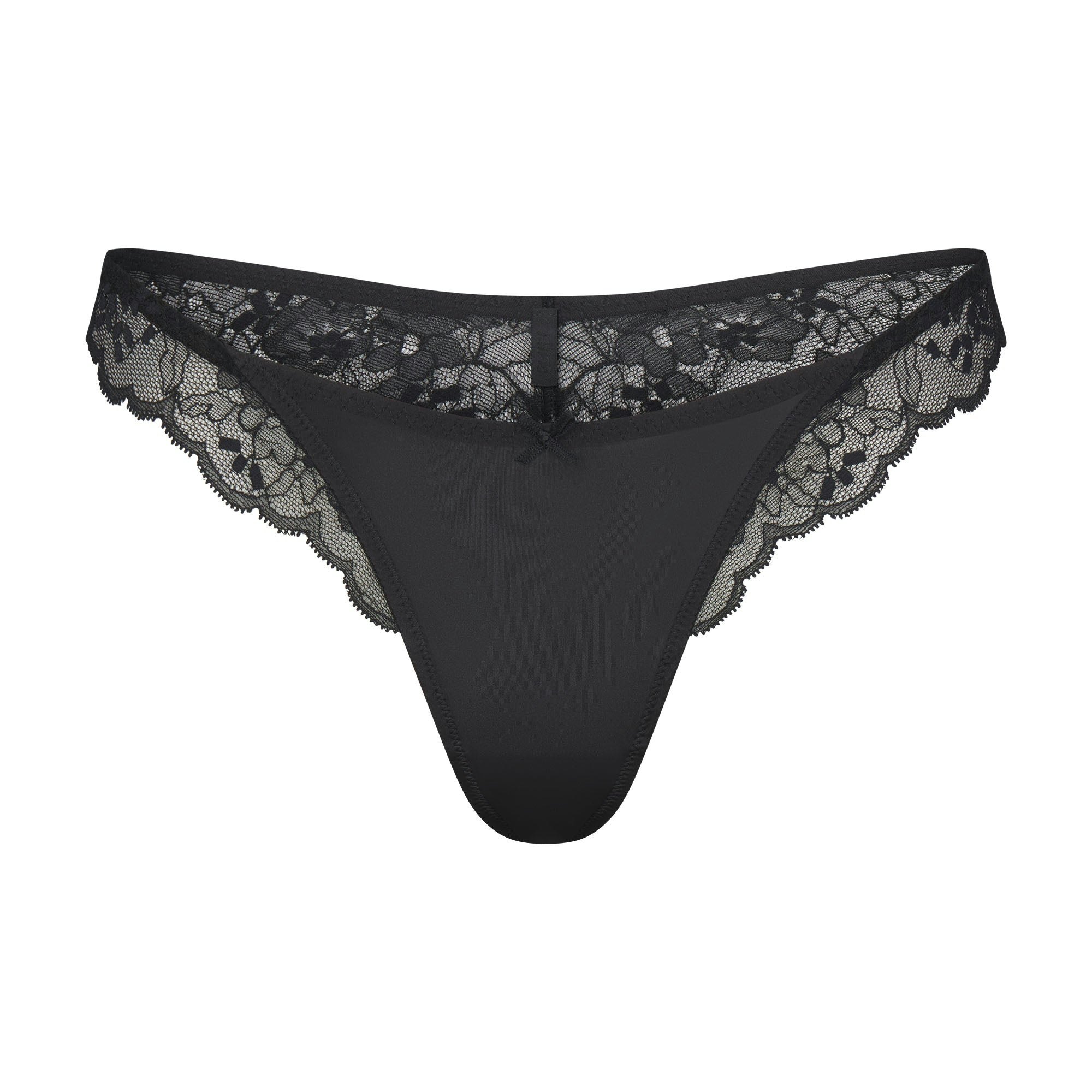 SKIMS LACE THONG | ONYX FLAT ON A WHITE BACKGROUND | FLT
