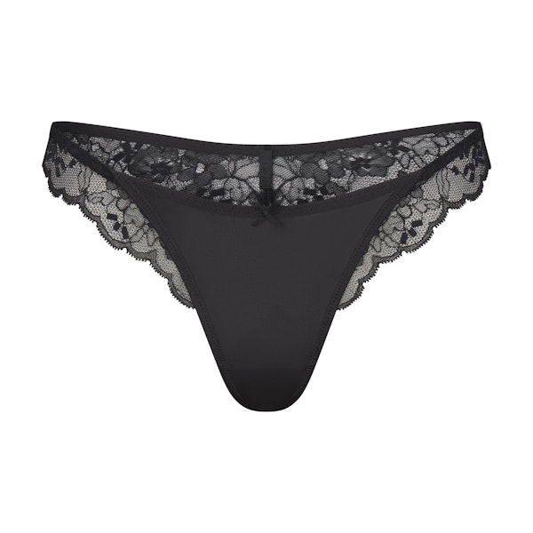 SKIMS LACE THONG | ONYX FLAT ON A WHITE BACKGROUND | FLT