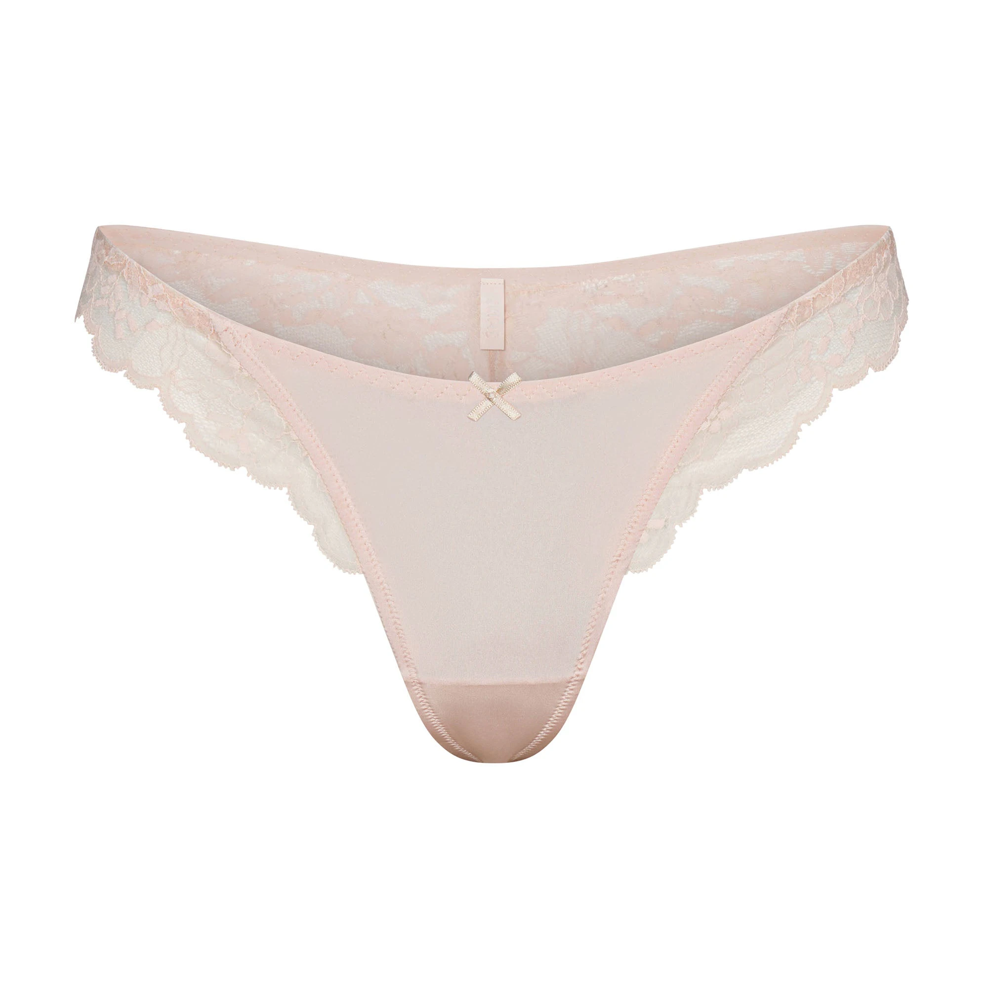 SKIMS LACE THONG | PRIMROSE FLAT ON A WHITE BACKGROUND | FLT