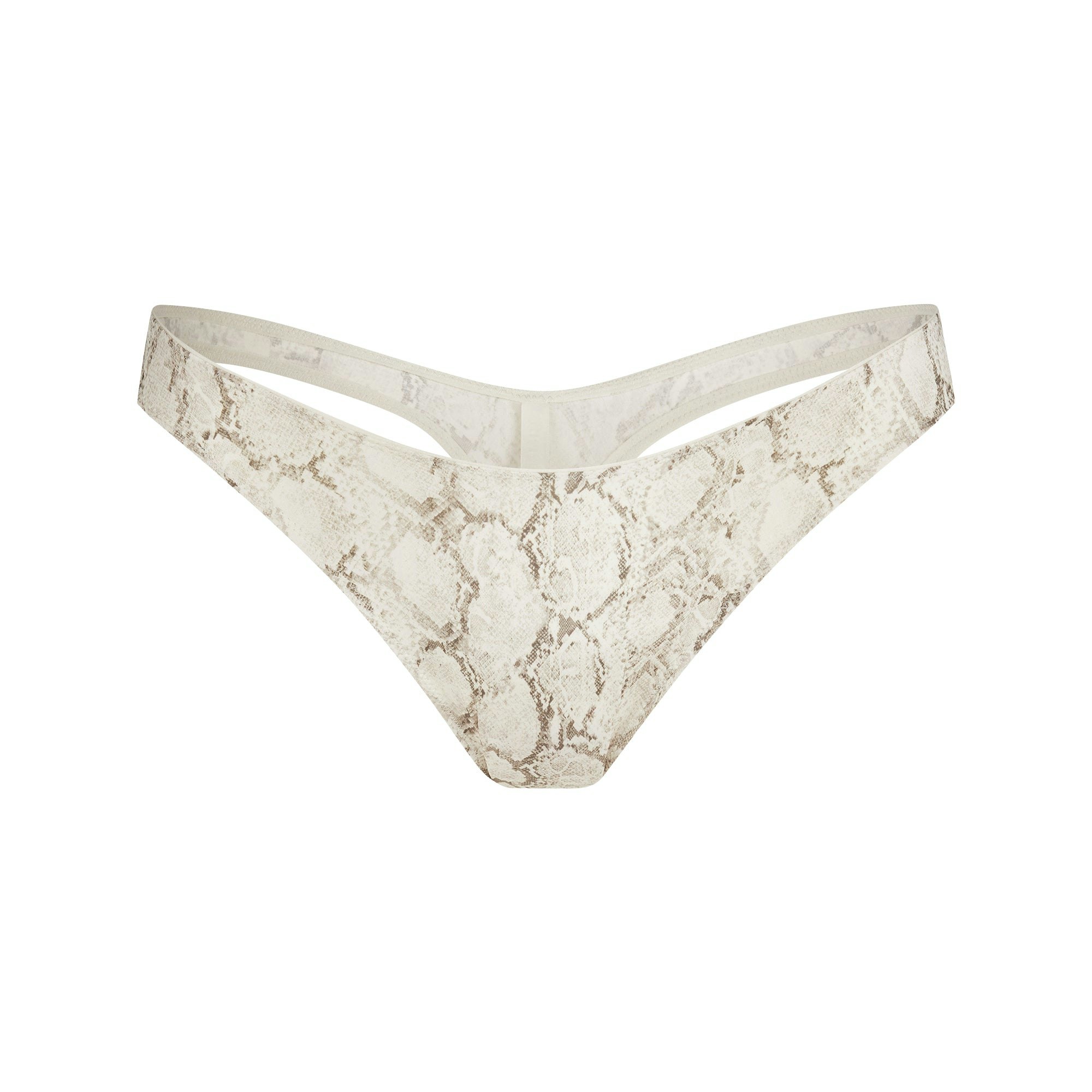 SHINE FOUNDATIONS DIPPED THONG | STONE PASTEL SNAKE PRINT FLAT ON A WHITE BACKGROUND | FLT
