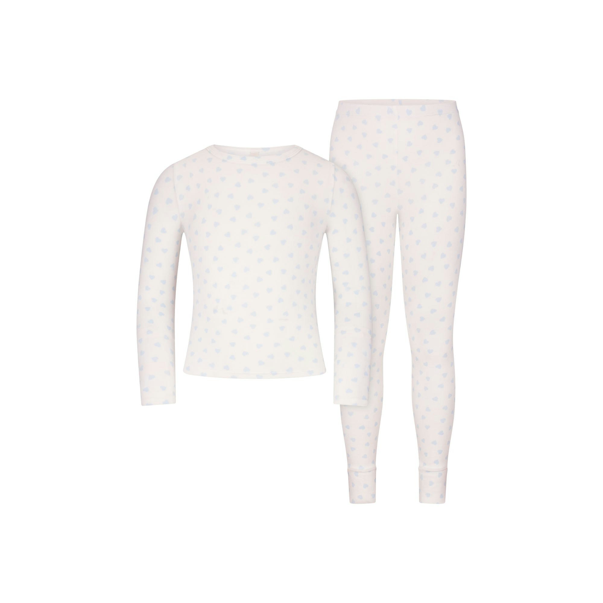 SKIMS SLEEP KIDS SLEEP SET | MARBLE CLOUD HEART PRINT FLAT ON A WHITE BACKGROUND | FLT