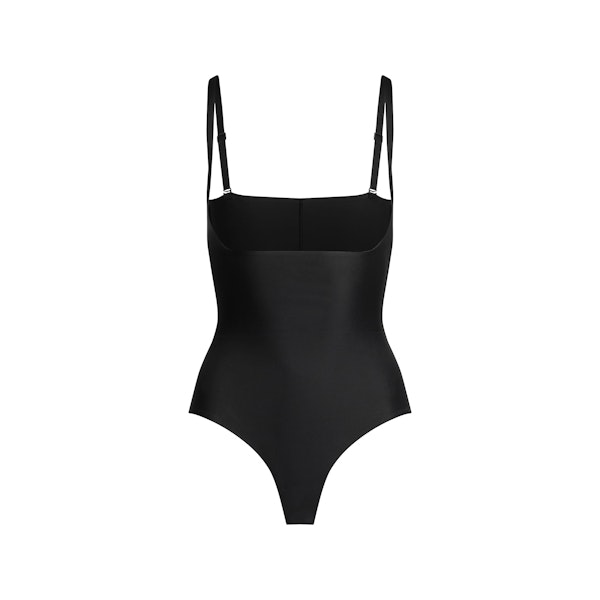 SKIMS BODY CORE SCULPT OPEN BUST THONG BODYSUIT | ONYX FLAT ON A WHITE BACKGROUND | FLT