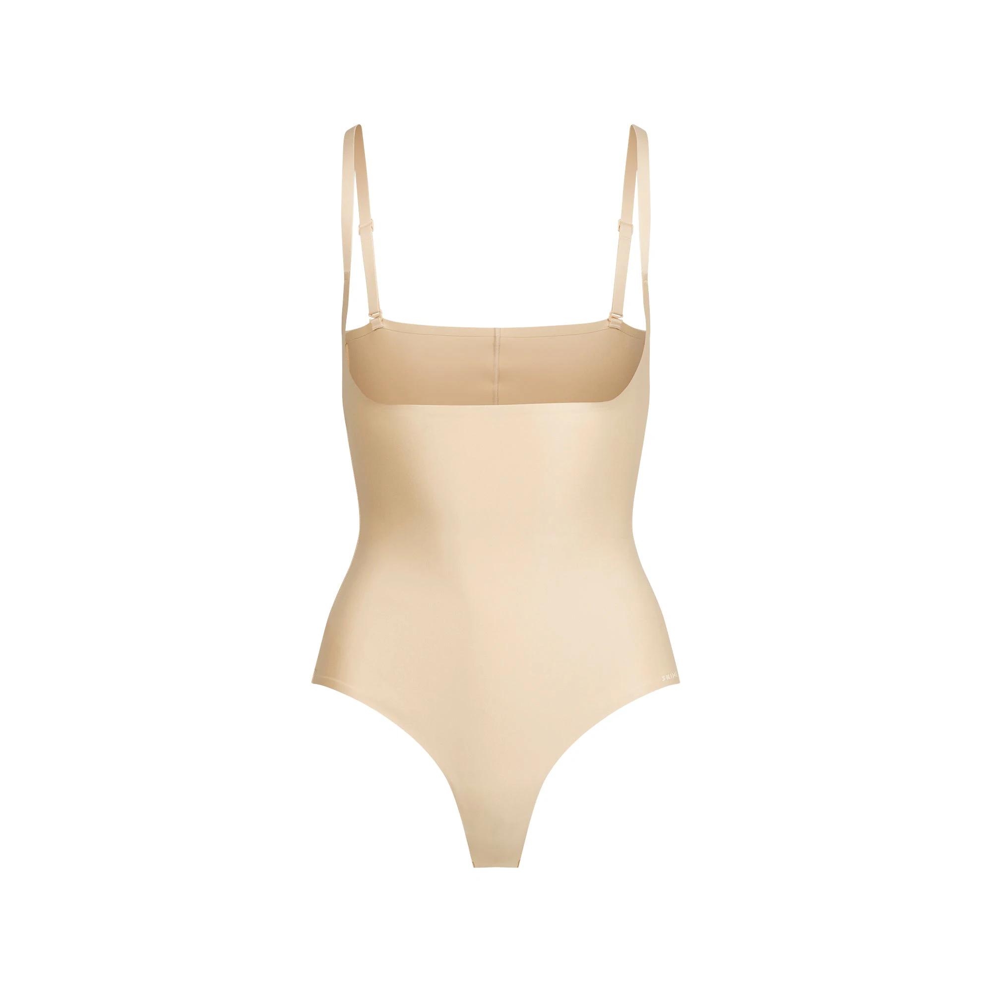 SKIMS BODY CORE SCULPT OPEN BUST THONG BODYSUIT | SAND FLAT ON A WHITE BACKGROUND | FLT