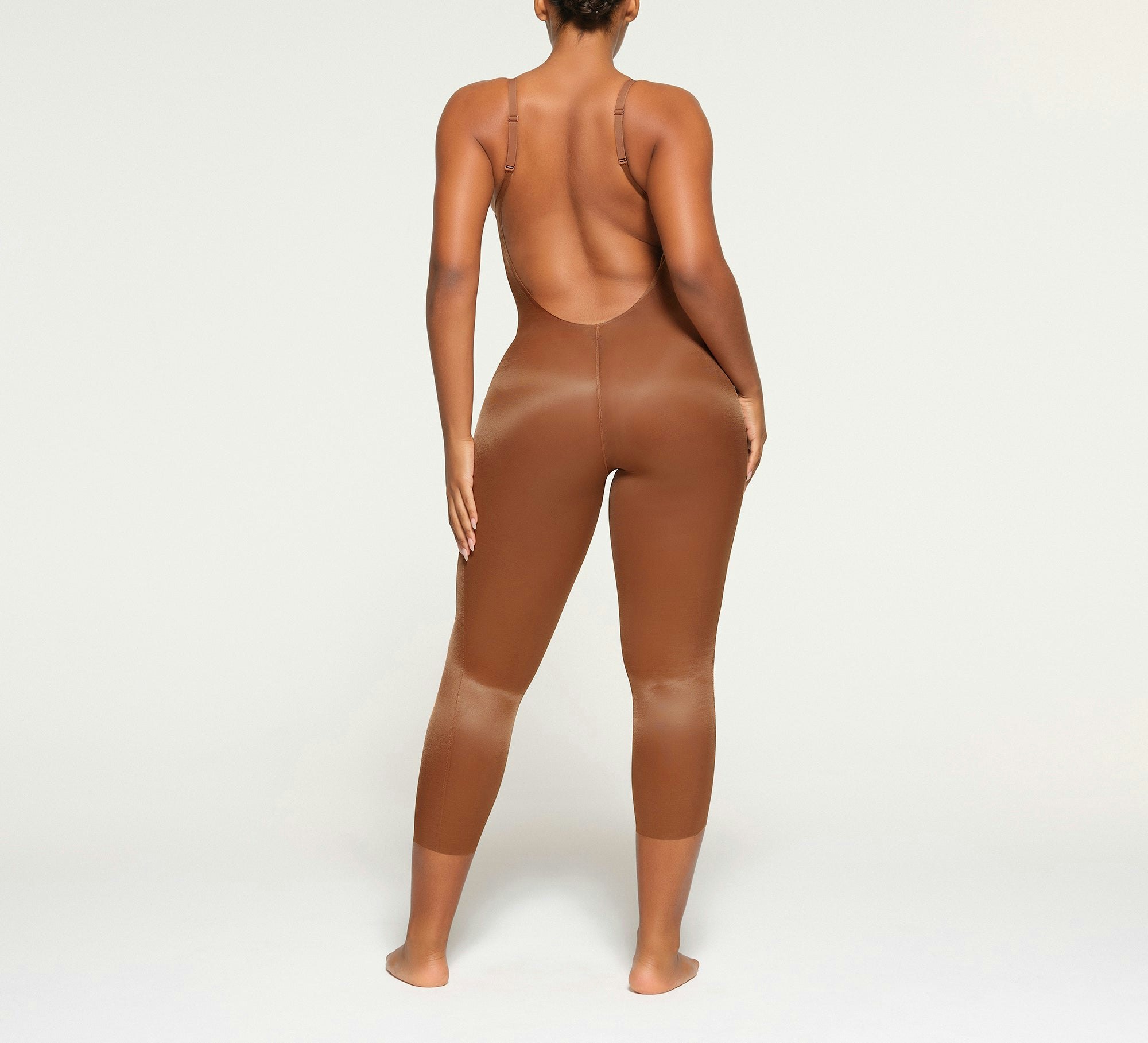 BARELY THERE LOW BACK CATSUIT ON A MODEL BACK VIEW