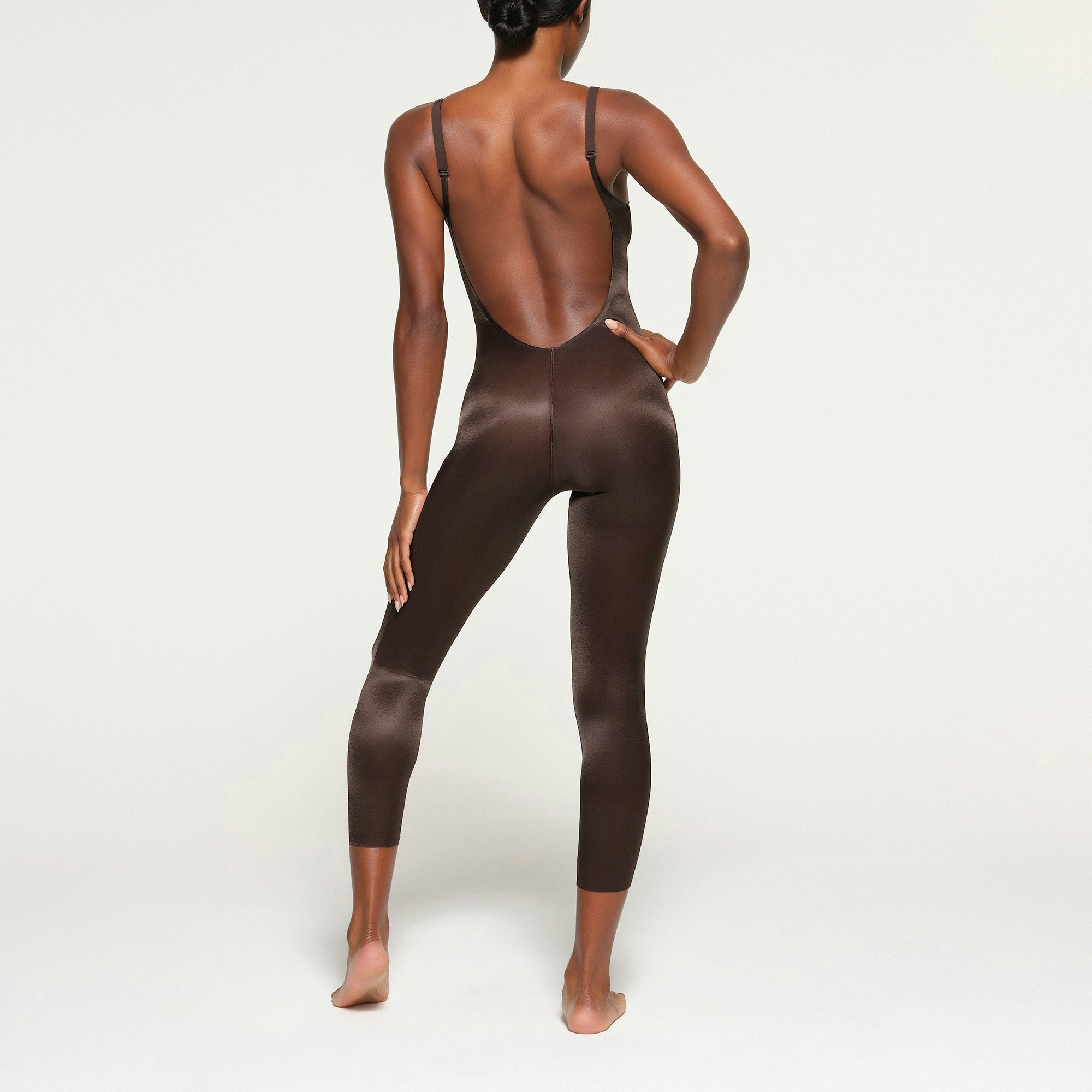 BARELY THERE LOW BACK CATSUIT ON A MODEL BACK VIEW