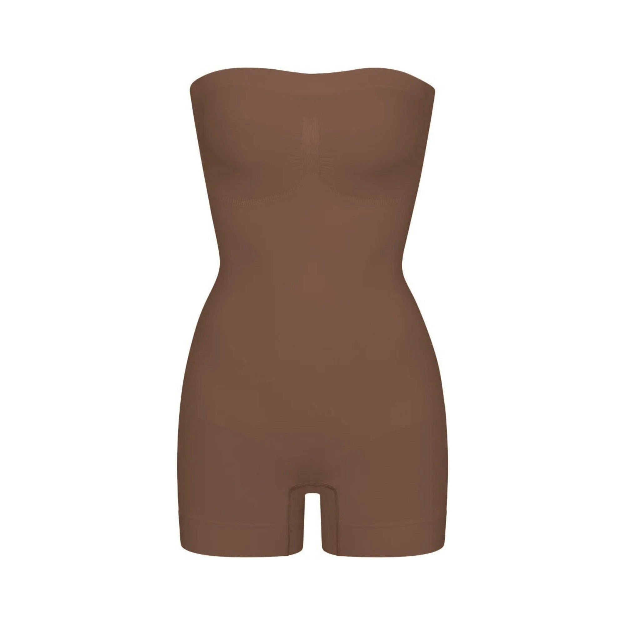 SEAMLESS SCULPT STRAPLESS SHORTIE BODYSUIT | JASPER (SHAPEWEAR BODYSUITS) LAYS FLAT ON A WHITE BACKGROUND | FLT