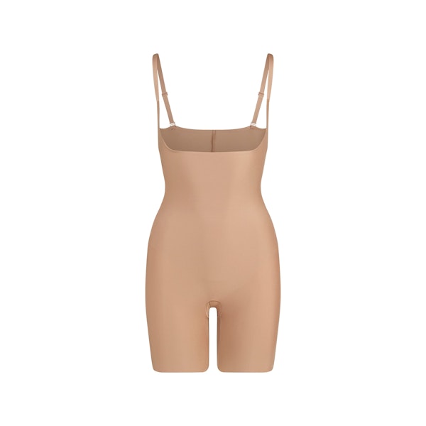 SKIMS BODY CORE SCULPT OPEN BUST MID THIGH BODYSUIT | SIENNA FLAT ON A WHITE BACKGROUND | FLT