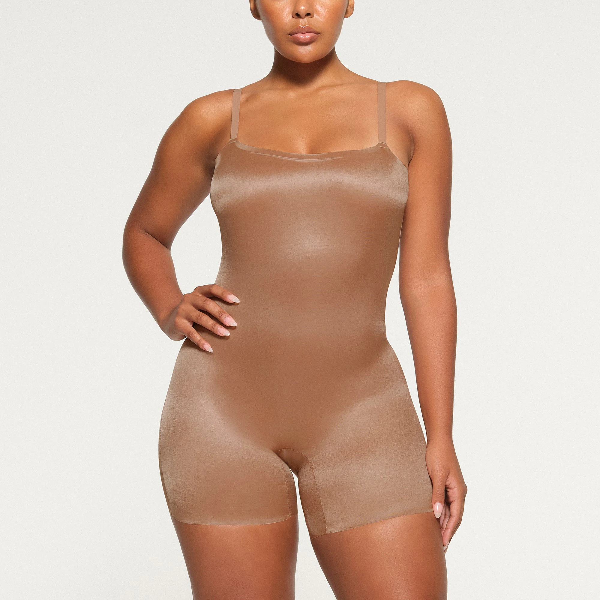 BARELY THERE LOW BACK MID THIGH BODYSUIT WORN BY A MODEL IN FRONT VIEW