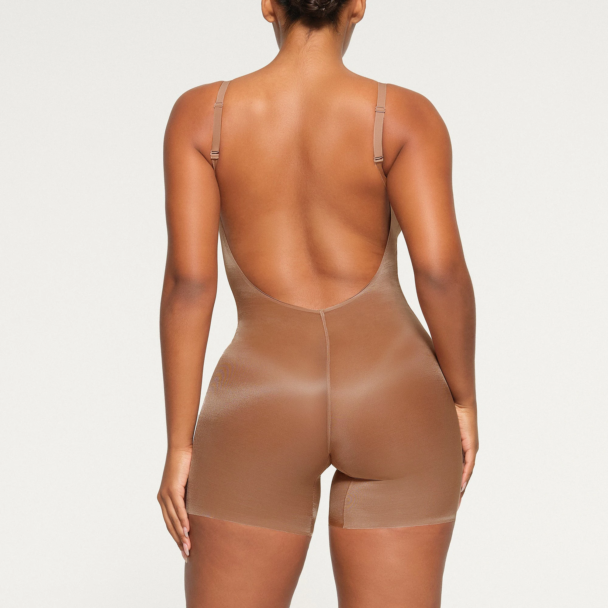 BARELY THERE LOW BACK MID THIGH BODYSUIT ON A MODEL BACK VIEW