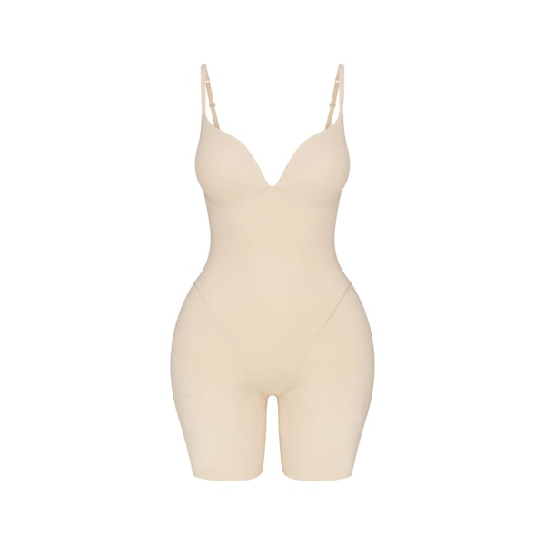 SKIMS ULTIMATE BODY BUTT AND HIP ENHANCING MID THIGH BODYSUIT | SAND FLAT ON A WHITE BACKGROUND | FLT