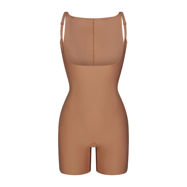 SKIMS BODY CORE SCULPT BACK SMOOTHING OPEN BUST MID THIGH BODYSUIT | SIENNA FLAT ON A WHITE BACKGROUND | FLT