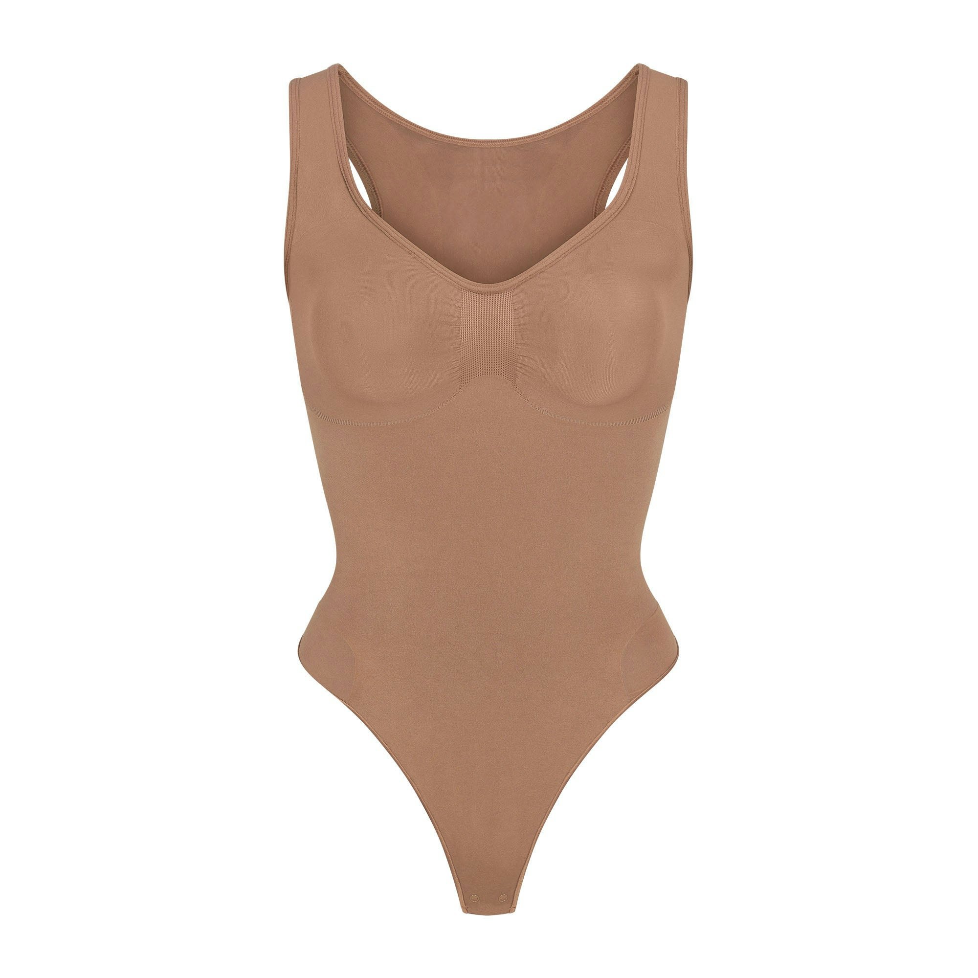 SEAMLESS SCULPT SCOOP NECK THONG BODYSUIT | SIENNA (SHAPEWEAR BODYSUITS) LAYS FLAT ON A WHITE BACKGROUND | FLT