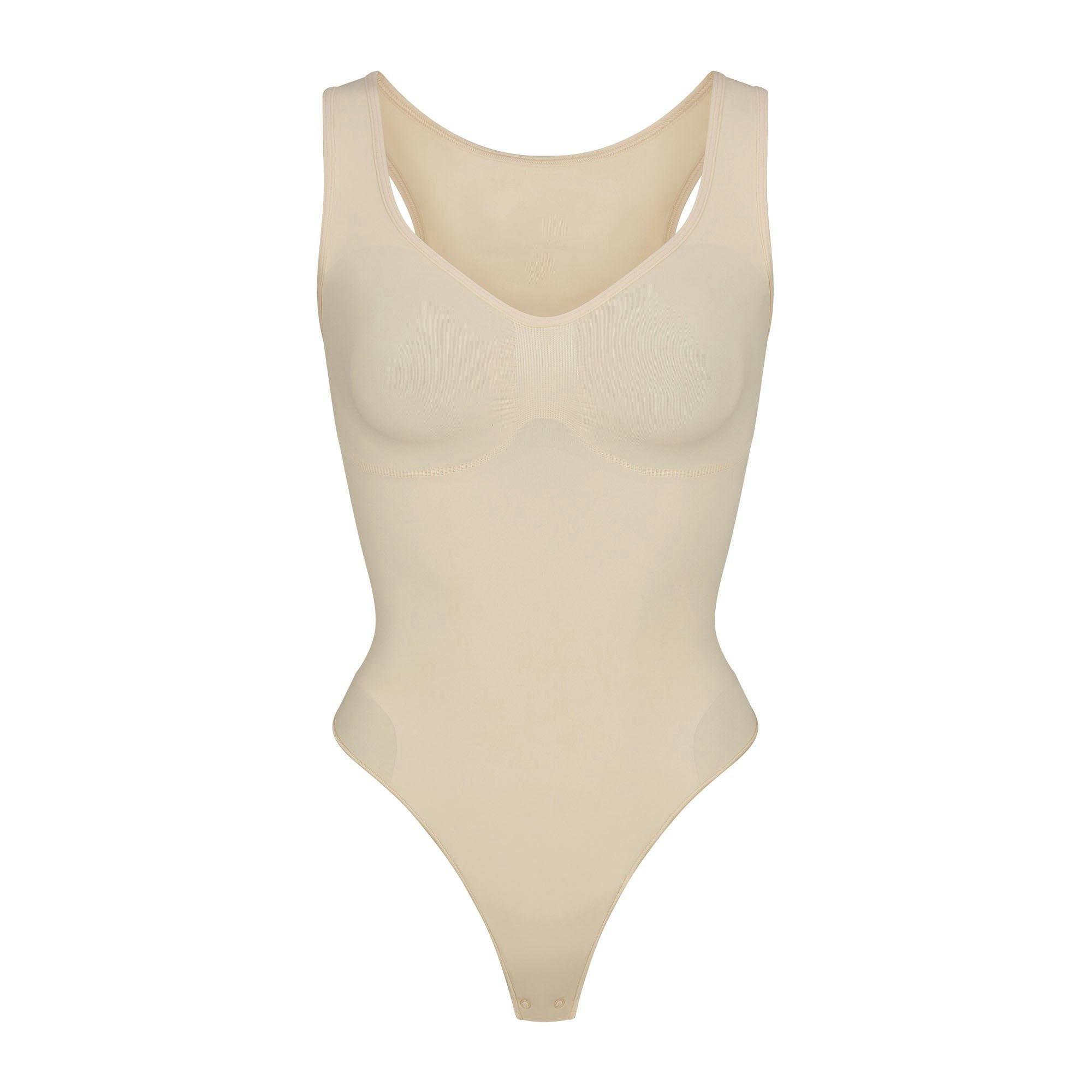 SEAMLESS SCULPT SCOOP NECK THONG BODYSUIT | SAND (SHAPEWEAR BODYSUITS) LAYS FLAT ON A WHITE BACKGROUND | FLT