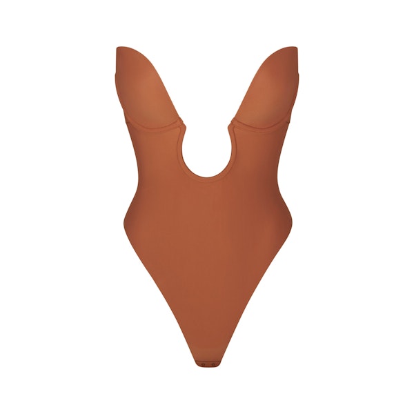 DEEP PLUNGE SHAPEWEAR BODYSUIT LAYS FLAT ON A WHITE BACKGROUND