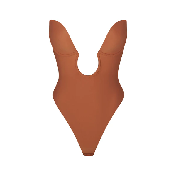 DEEP PLUNGE SHAPEWEAR BODYSUIT LAYS FLAT ON A WHITE BACKGROUND
