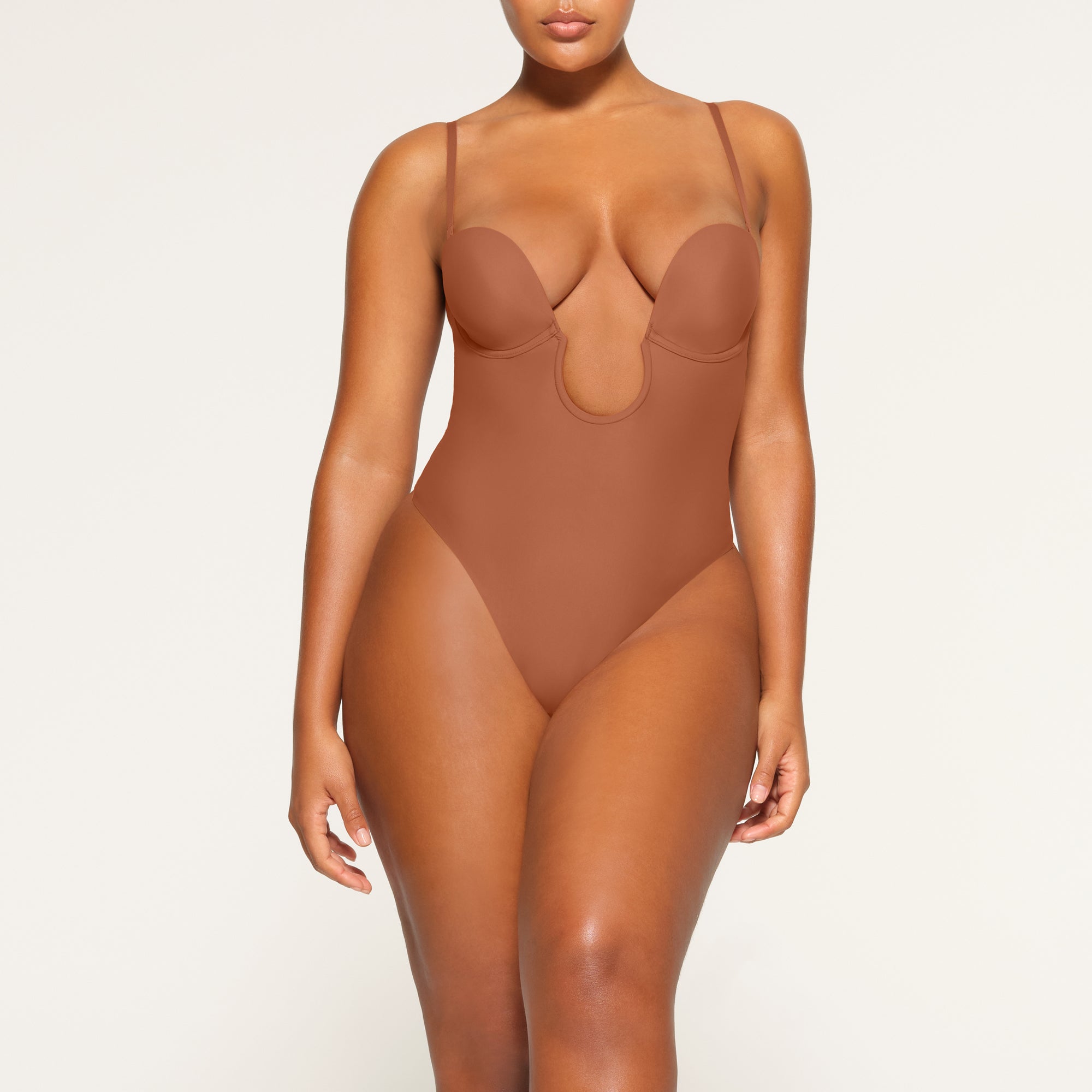 DEEP PLUNGE SHAPEWEAR BODYSUIT WORN BY A MODEL IN FRONT VIEW | SEE: M, L, XL