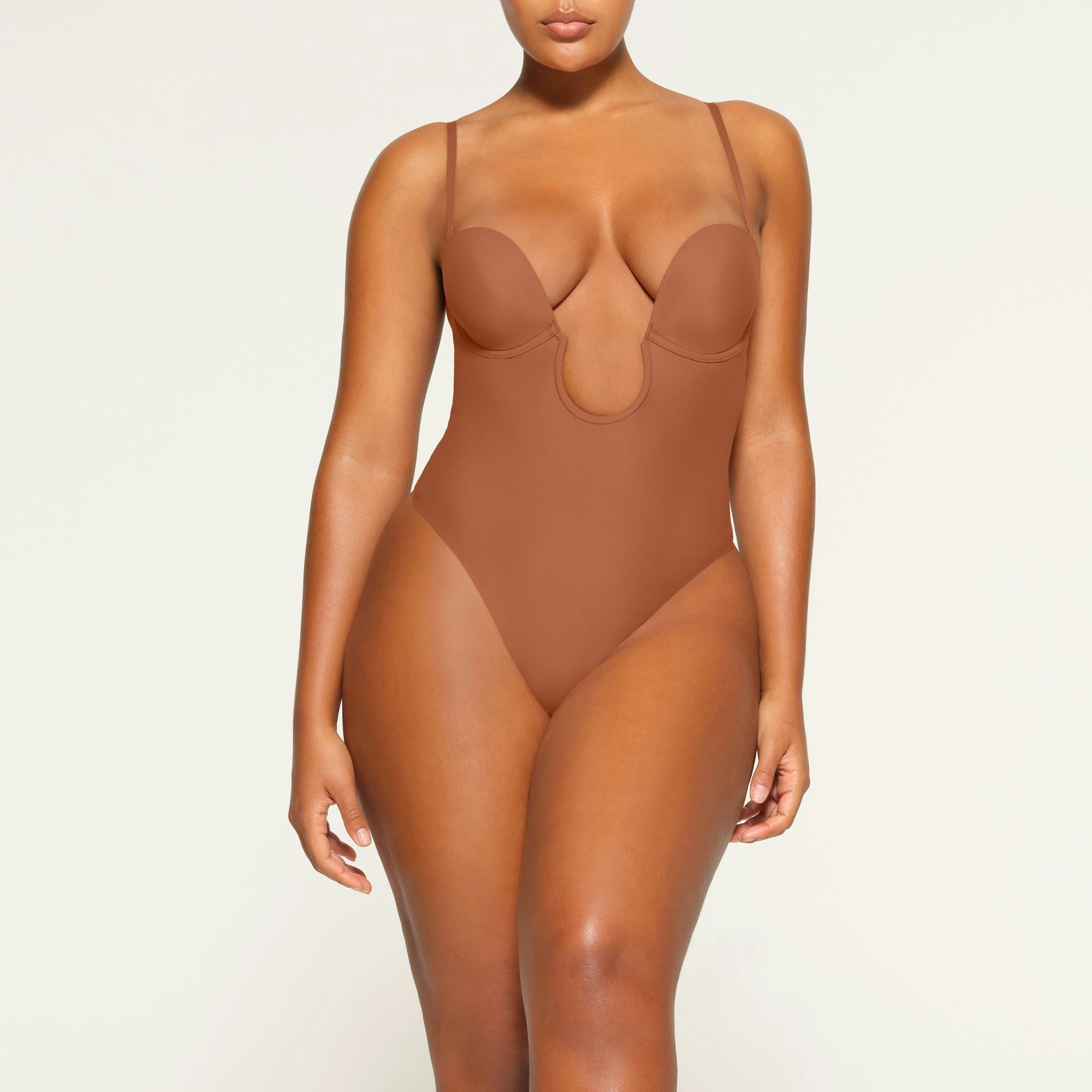 DEEP PLUNGE SHAPEWEAR BODYSUIT WORN BY A MODEL IN FRONT VIEW | SEE: M, L, XL