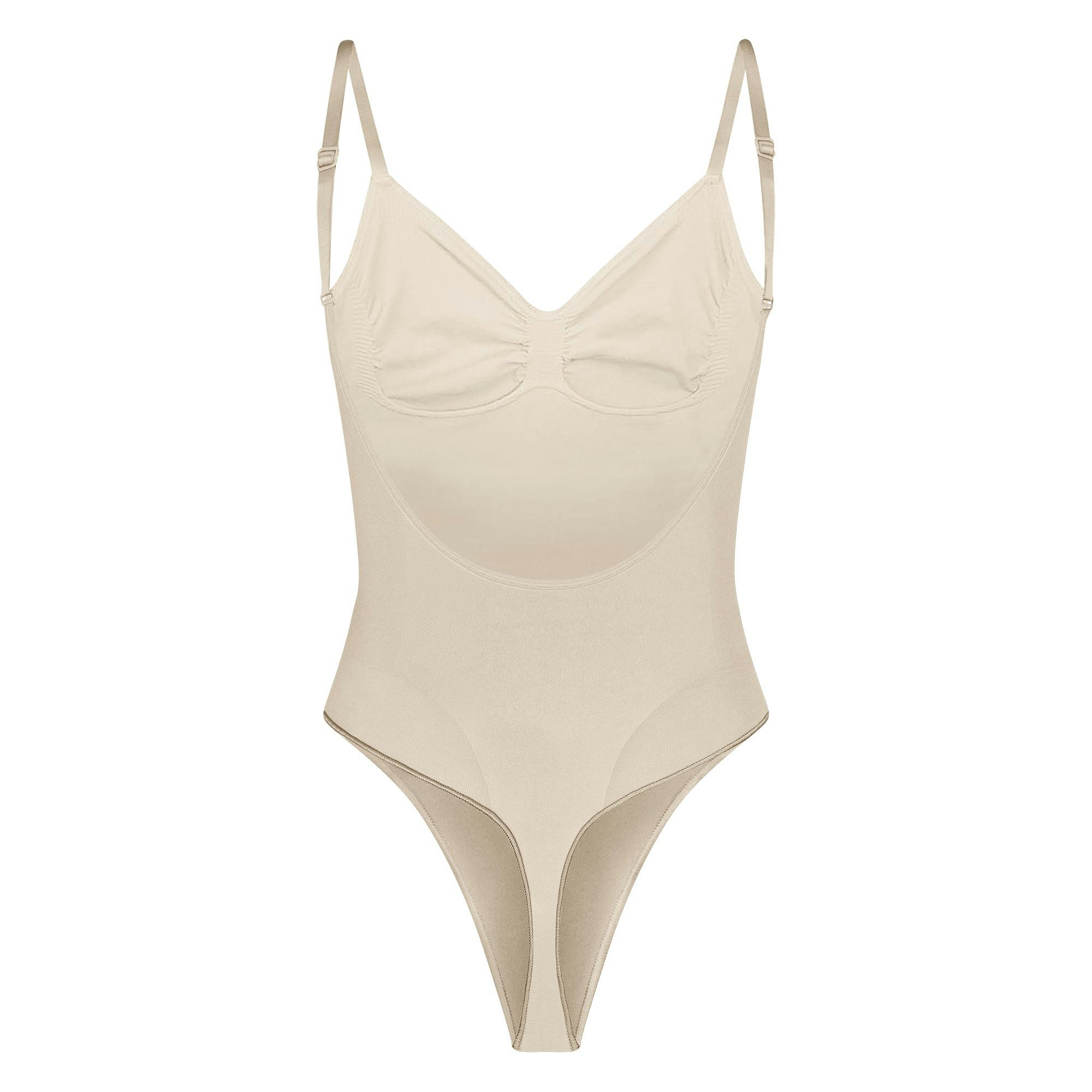 SEAMLESS SCULPT LOW BACK THONG BODYSUIT LAYS FLAT ON A WHITE BACKGROUND | FLT