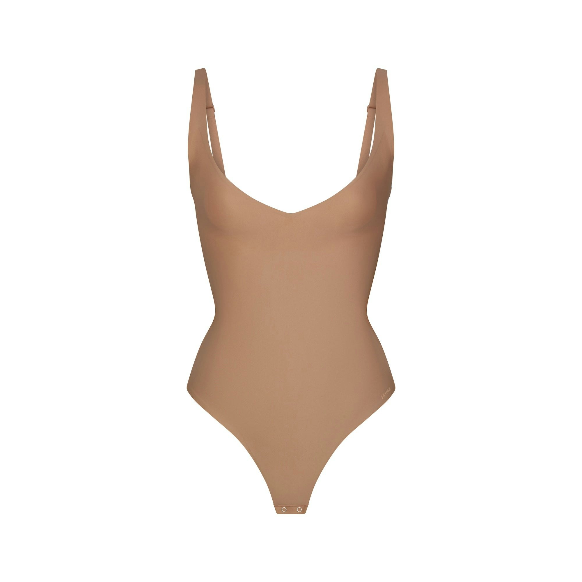 SKIMS BODY CORE SCULPT PLUNGE THONG BODYSUIT | SIENNA (SHAPEWEAR BODYSUITS) FLAT ON A WHITE BACKGROUND | FLT