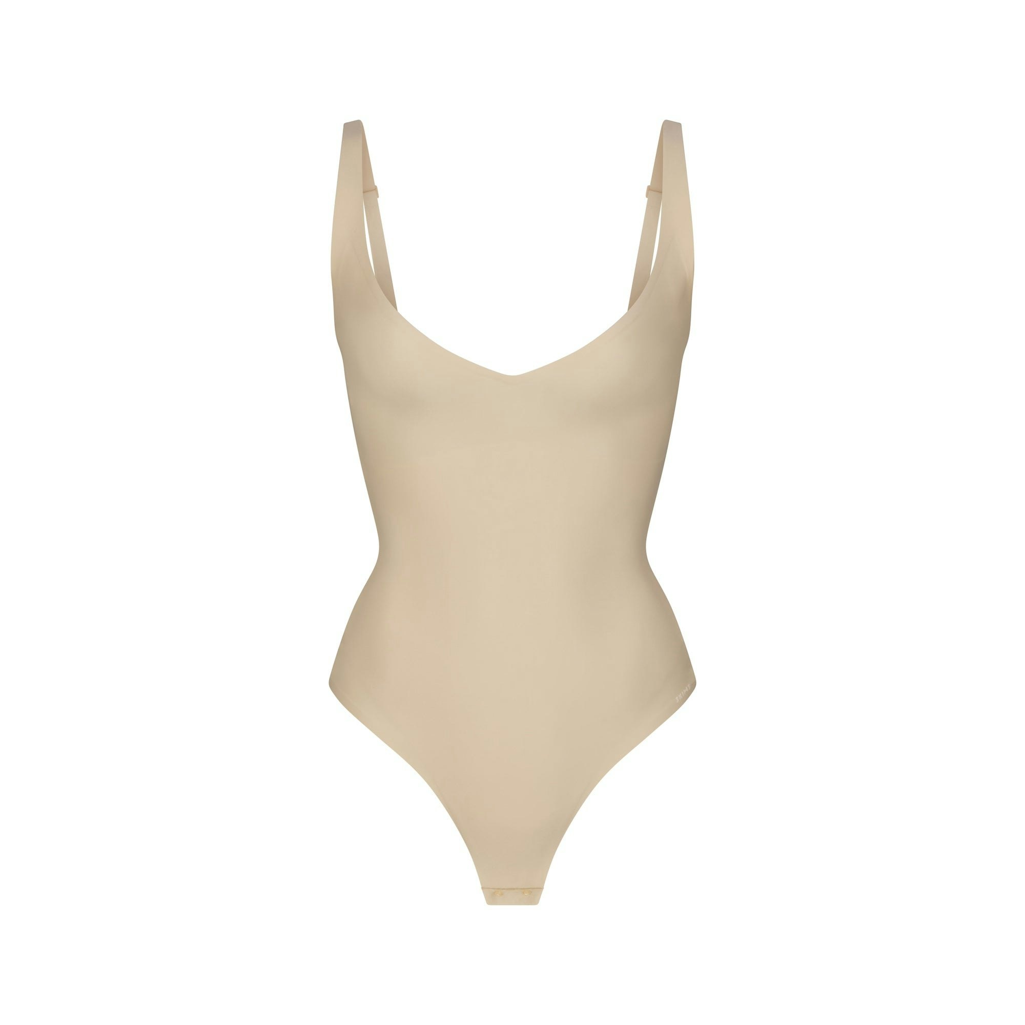 SKIMS BODY CORE SCULPT PLUNGE THONG BODYSUIT | SAND (SHAPEWEAR BODYSUITS) FLAT ON A WHITE BACKGROUND | FLT