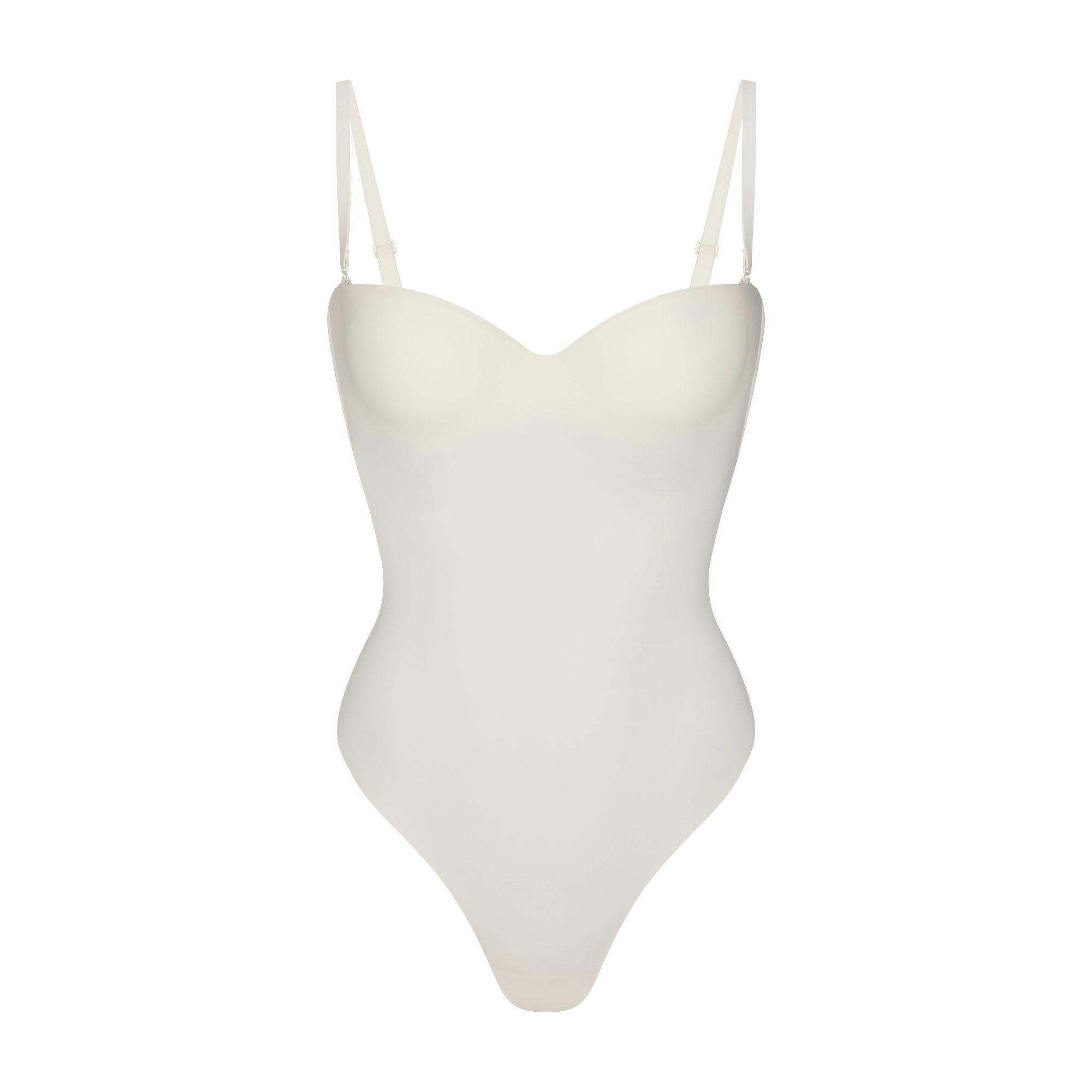 SKIMS BODY UNDERWIRE THONG BODYSUIT | IVORY FLAT ON A WHITE BACKGROUND | FLT