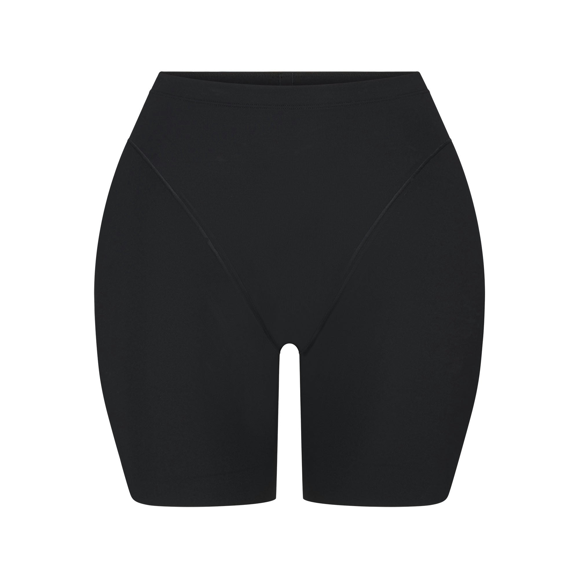 SKIMS BODY BUTT AND HIP ENHANCING MID THIGH SHORT | ONYX FLAT ON A WHITE BACKGROUND | FLT