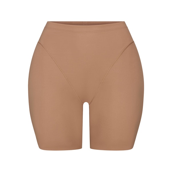 SKIMS BODY BUTT AND HIP ENHANCING MID THIGH SHORT | SIENNA FLAT ON A WHITE BACKGROUND | FLT