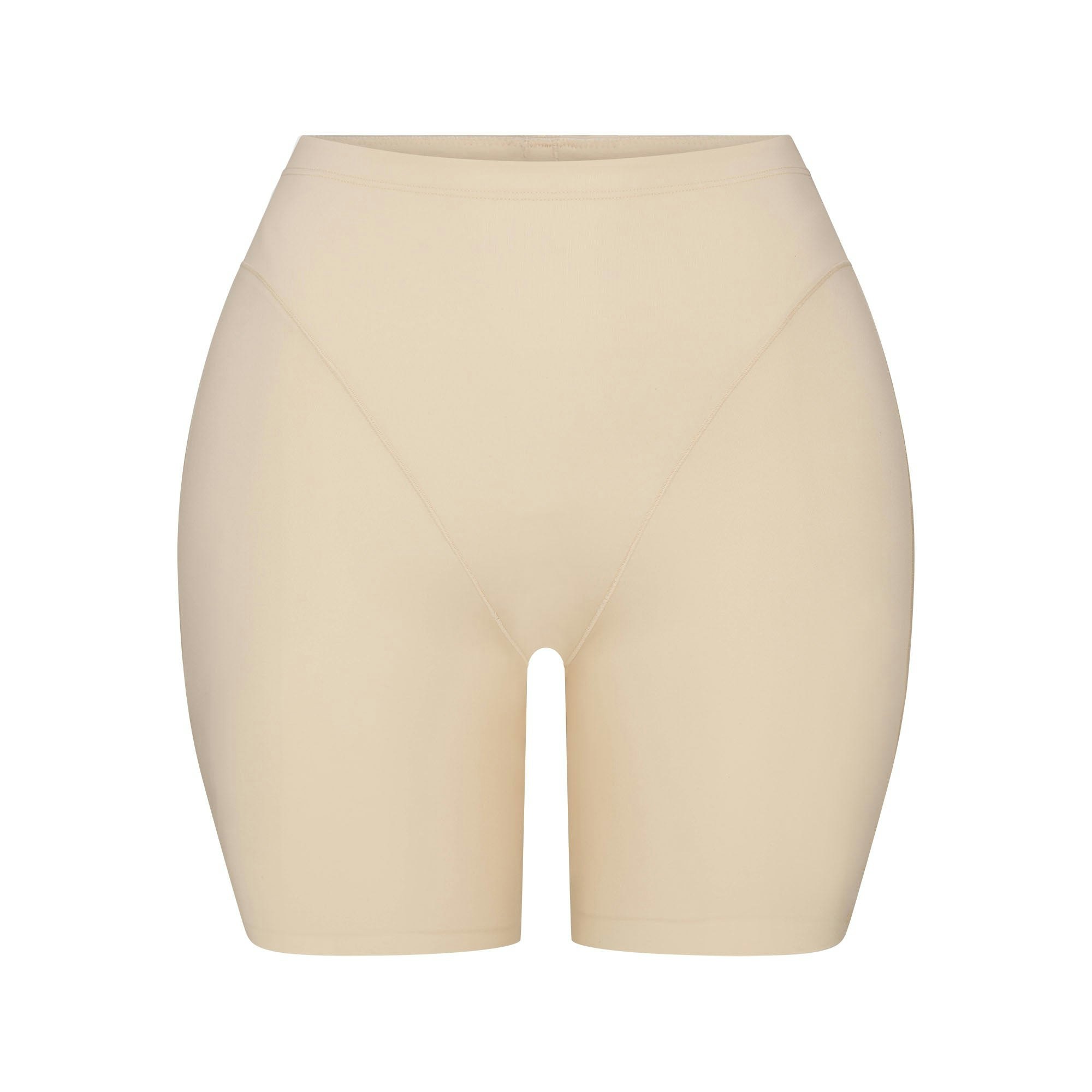 SKIMS BODY BUTT AND HIP ENHANCING MID THIGH SHORT | SAND FLAT ON A WHITE BACKGROUND | FLT