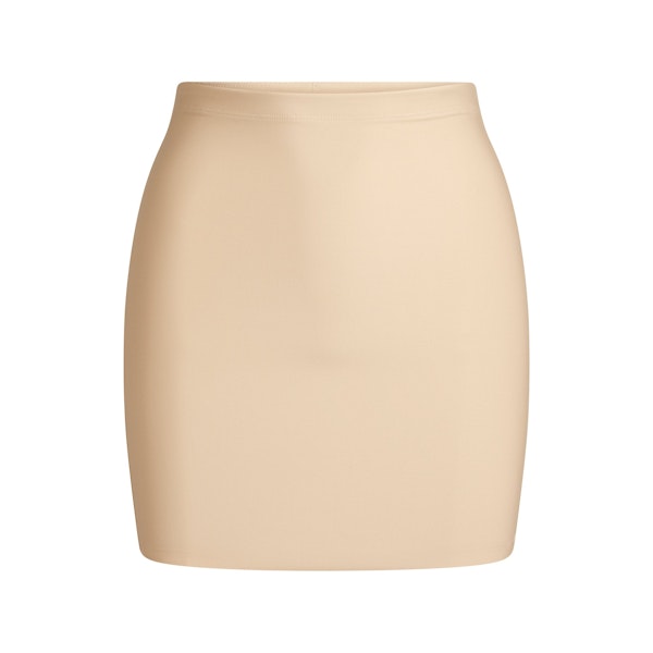 SKIMS BODY CORE SCULPT SKORT | SAND FLAT ON A WHITE BACKGROUND | FLT