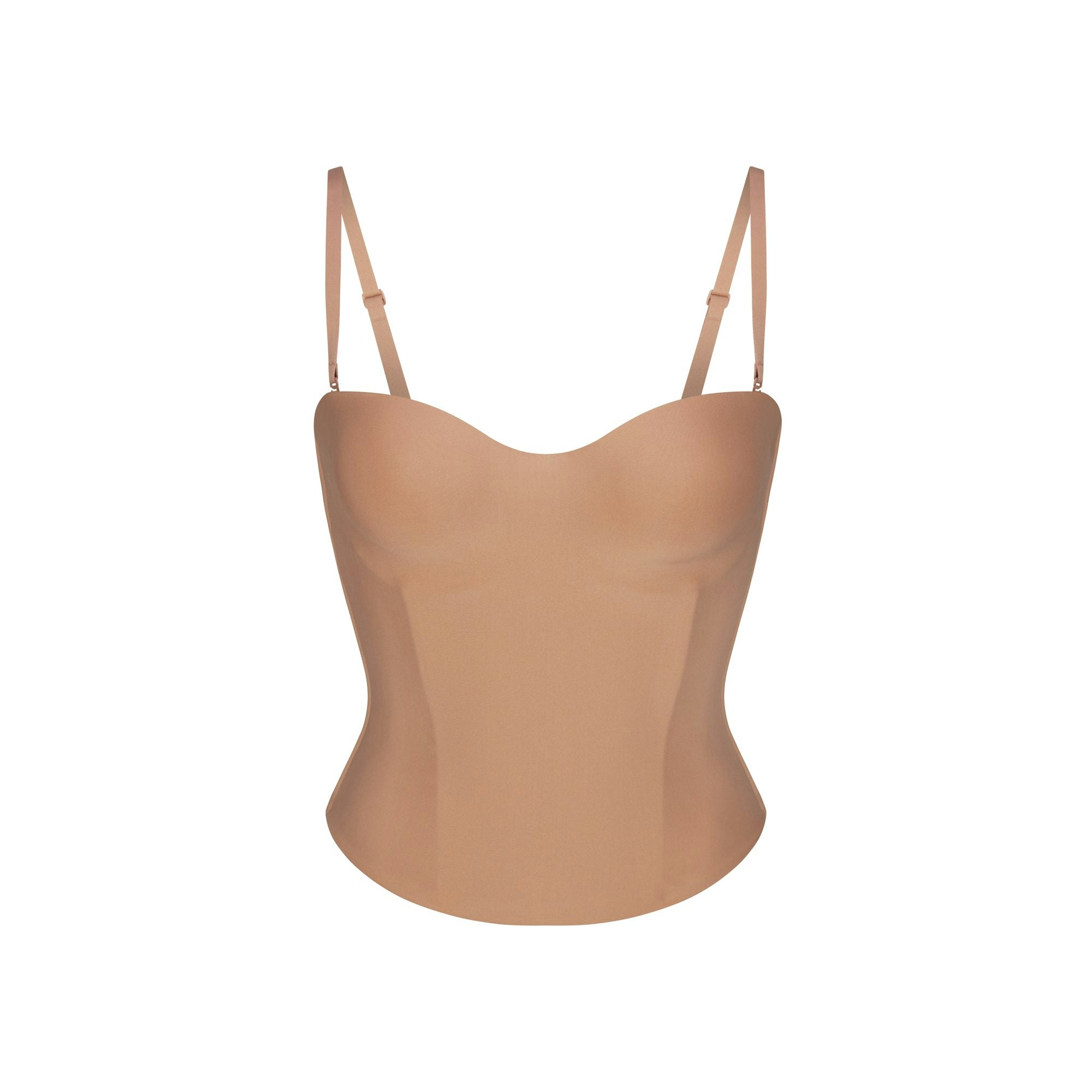 SKIMS BODY CORSET | SIENNA LAYS FLAT ON A WHITE BACKGROUND