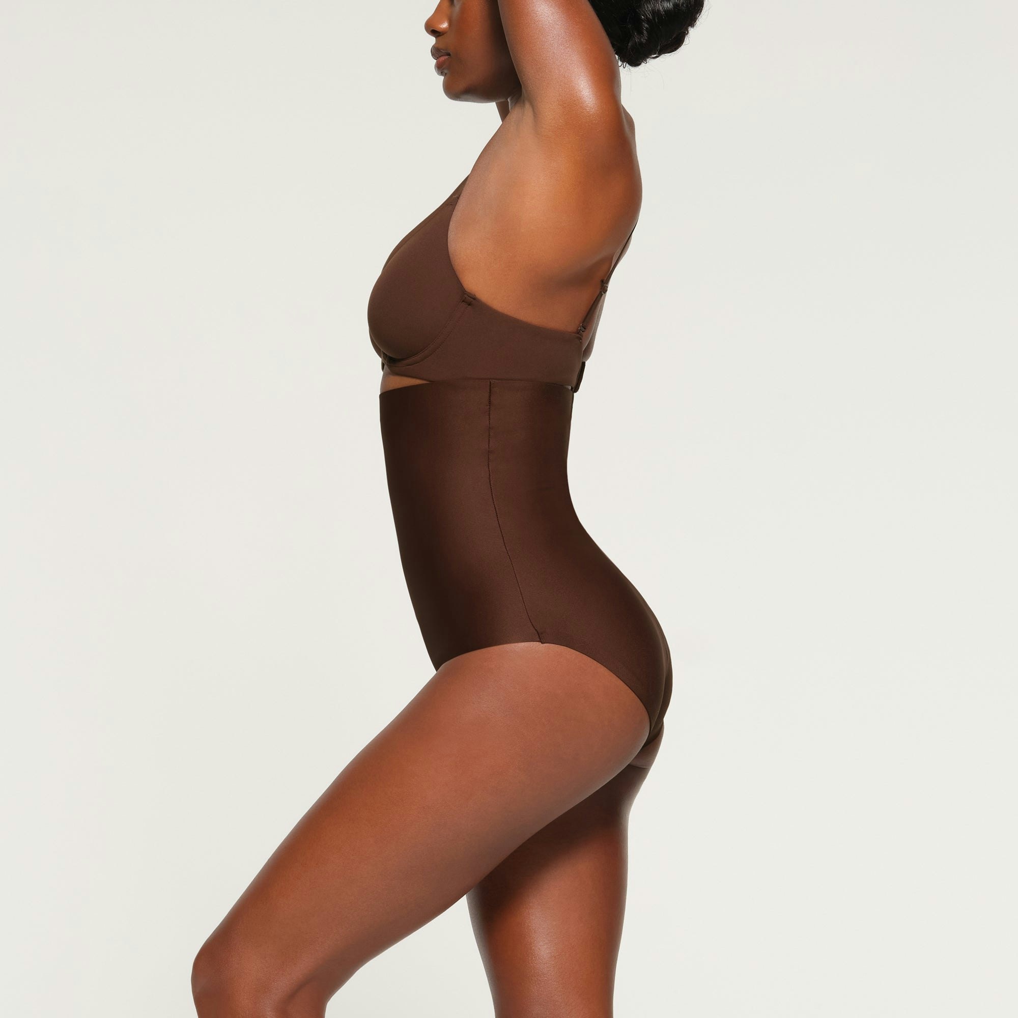 SKIMS BODY HIGH-WAISTED BRIEF WORN BY A MODEL IN SIDE VIEW
