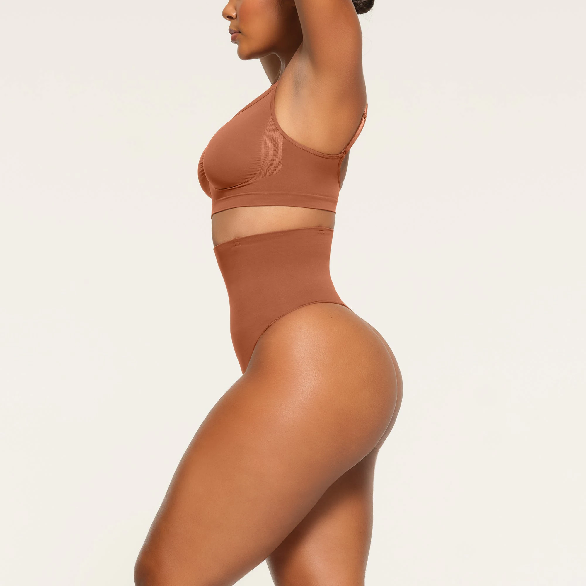 CORE CONTROL HIGH WAISTED THONG WORN BY A MODEL IN SIDE VIEW