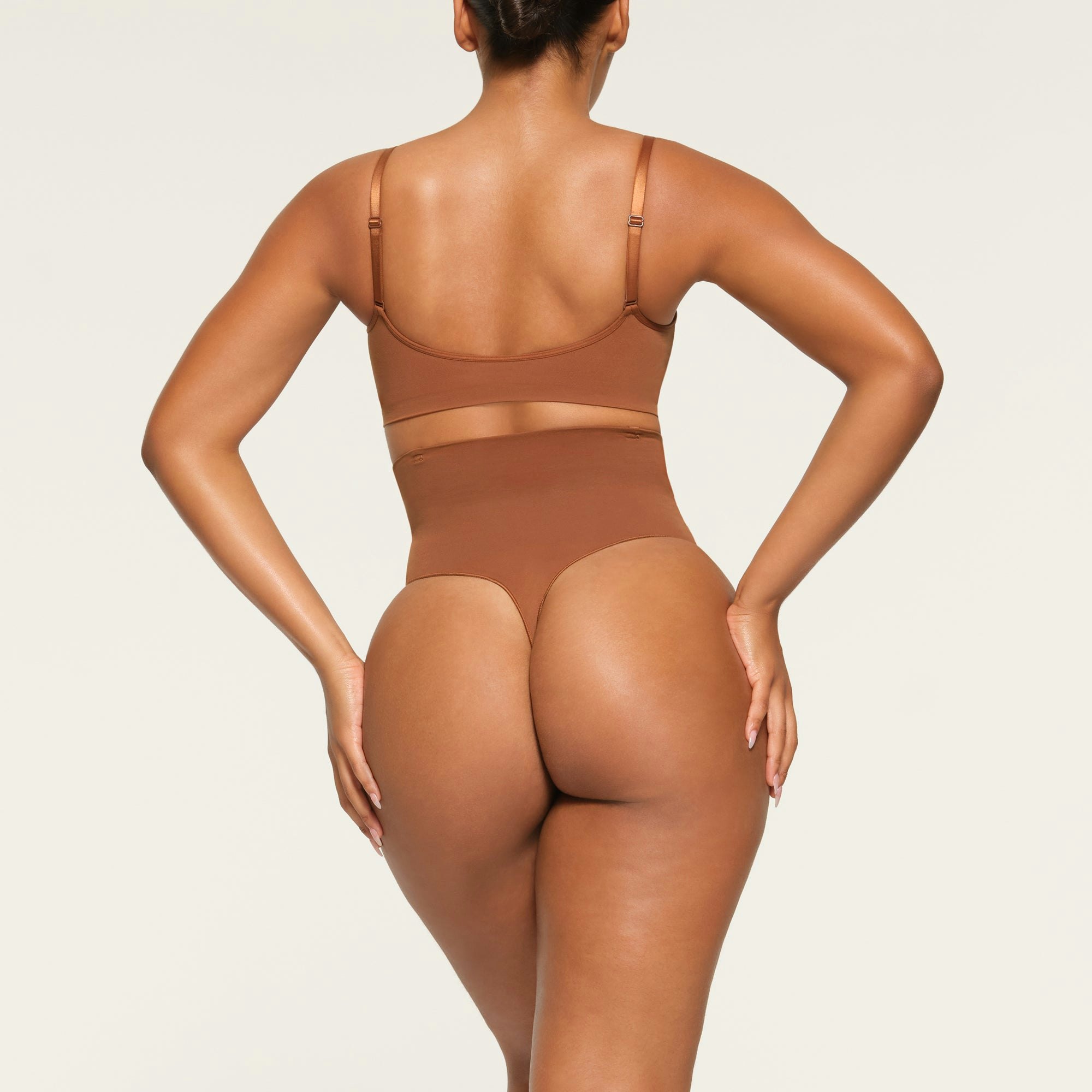 CORE CONTROL HIGH WAISTED THONG ON A MODEL BACK VIEW