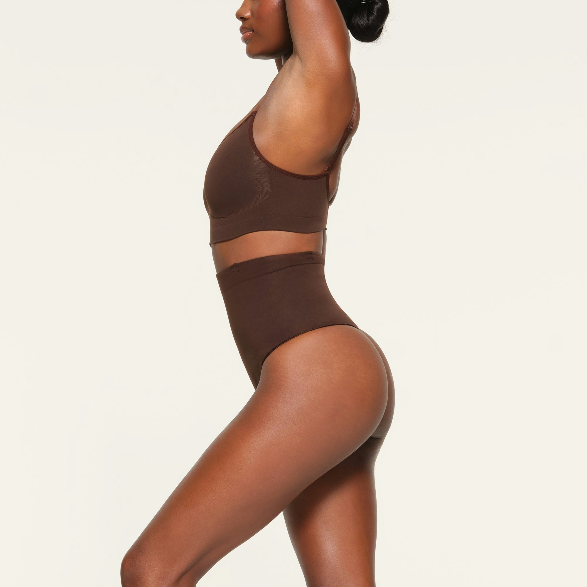 CORE CONTROL HIGH WAISTED THONG WORN BY A MODEL IN SIDE VIEW