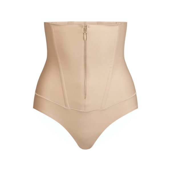 SKIMS BODY CORE SCULPT WAIST CINCHER THONG | CLAY FLAT ON A WHITE BACKGROUND | FLT