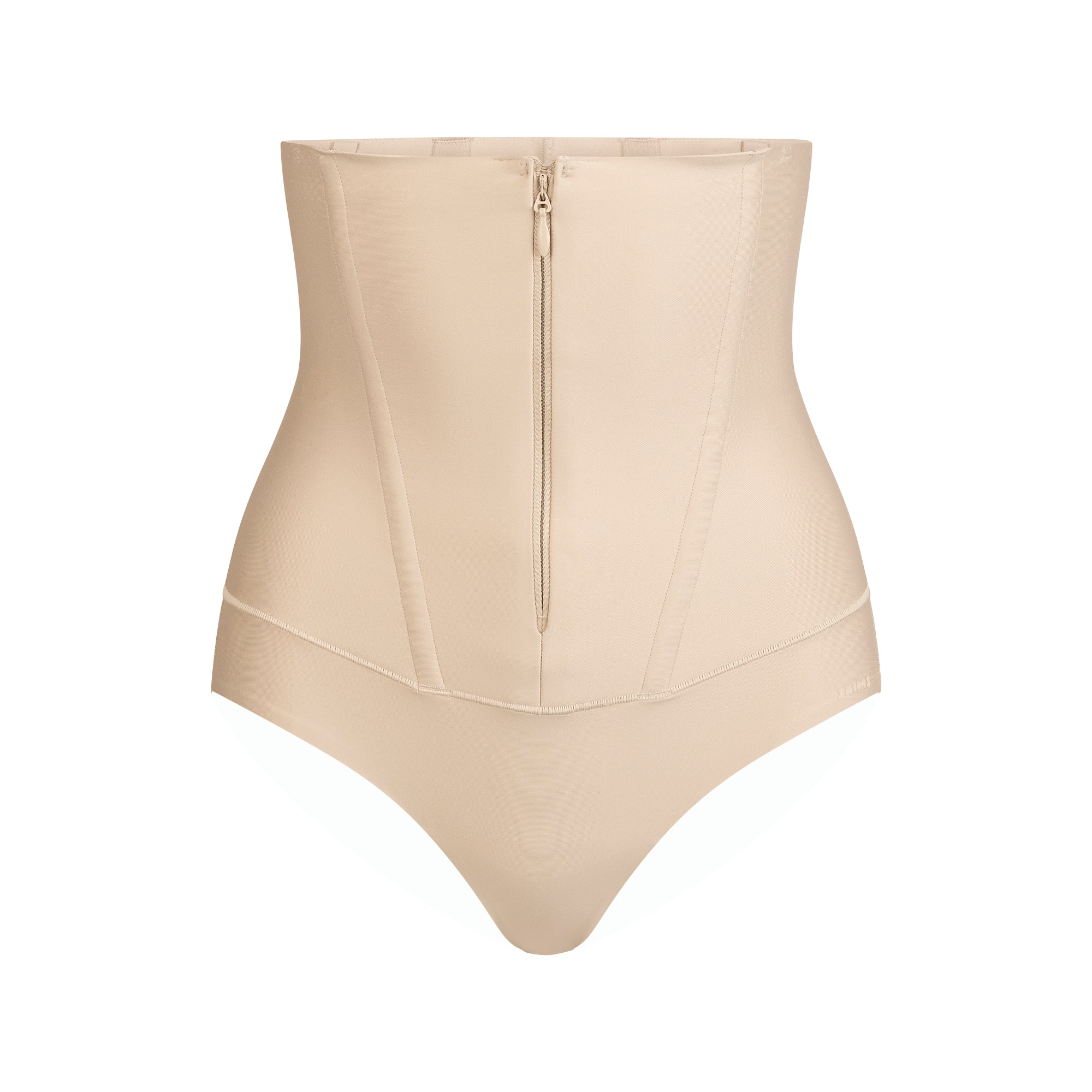SKIMS BODY CORE SCULPT WAIST CINCHER THONG | SAND FLAT ON A WHITE BACKGROUND | FLT