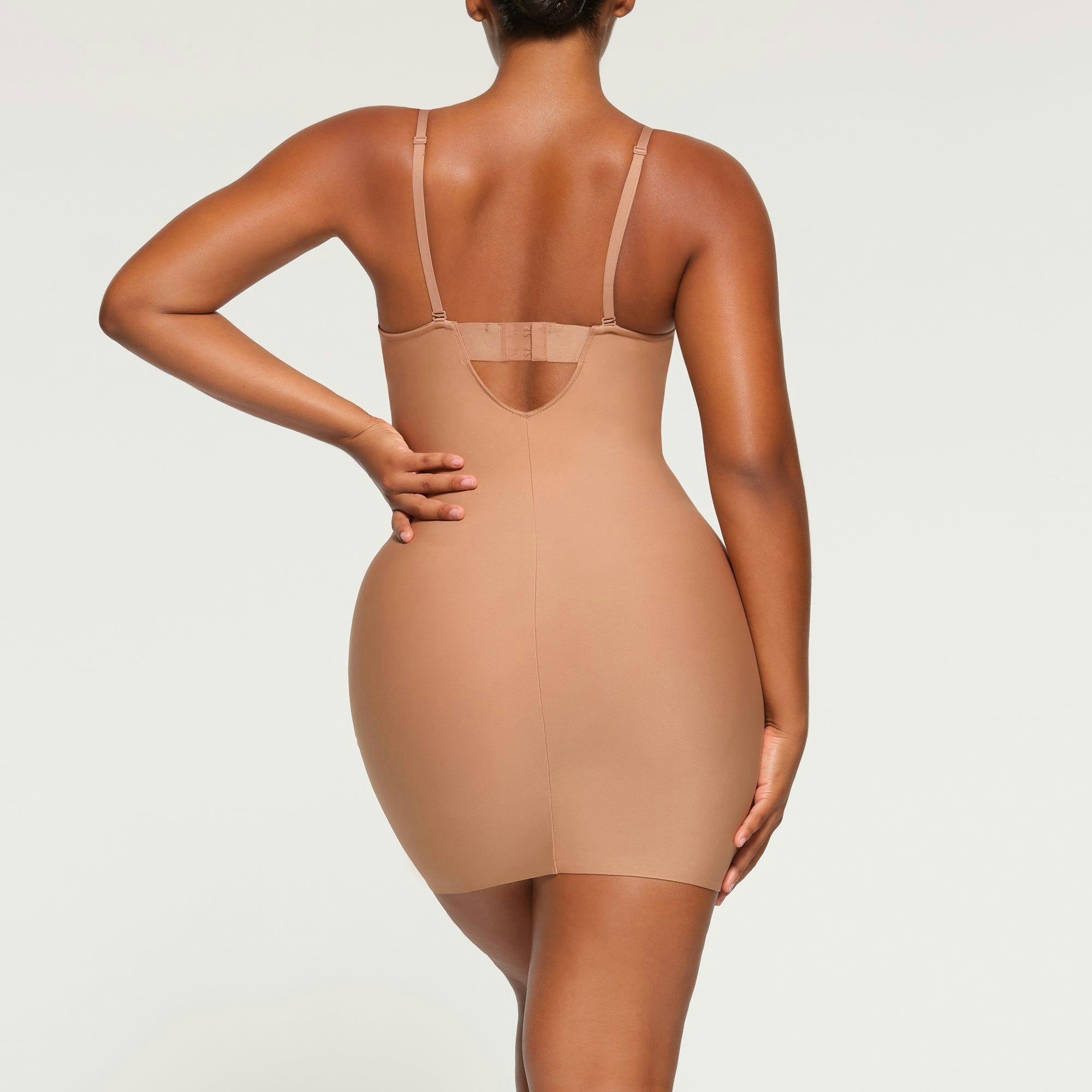SKIMS BODY UNDERWIRE SLIP DRESS ON A MODEL BACK VIEW