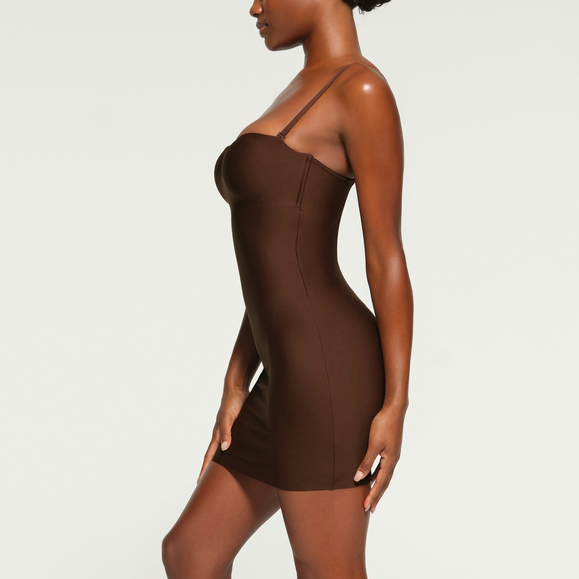 SKIMS BODY UNDERWIRE SLIP DRESS WORN BY A MODEL IN SIDE VIEW