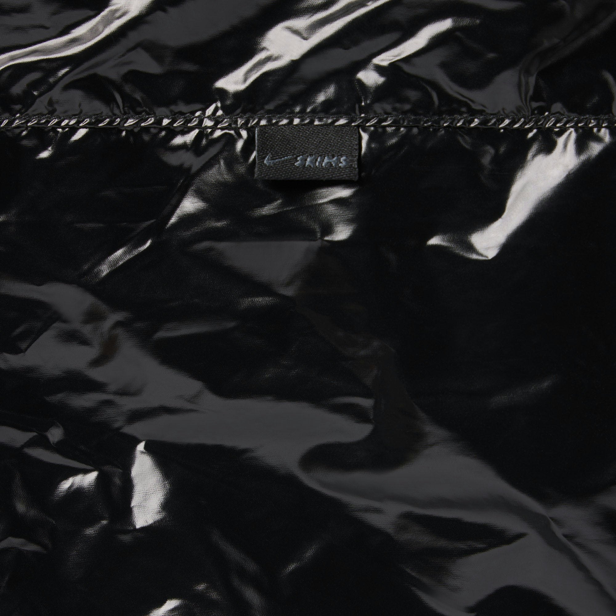 NikeSKIMS SHINY NYLON CARGO PANT | OBSIDIAN ON A MODEL SIDE VIEW @ | FOCUS: 0.0, 1.0, 0.9