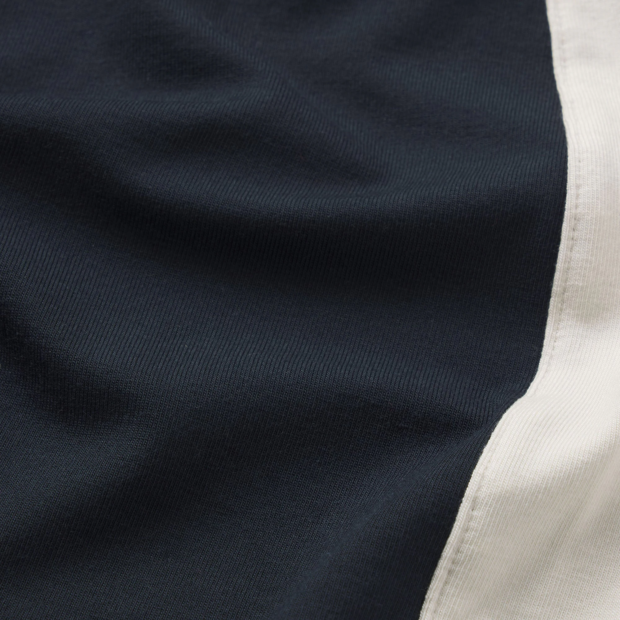 SMOOTH LAYERS MICRO SHORT | ONYX ECRU CONTRAST & LAYS FLAT ON A WHITE BACKGROUND | FLT