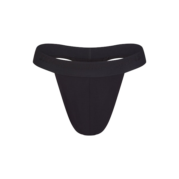 SKIMS STRETCH MENS THONG | OBSIDIAN FLAT ON A WHITE BACKGROUND | FLT @ | FOCUS: 0.0, 1.0, 0.9