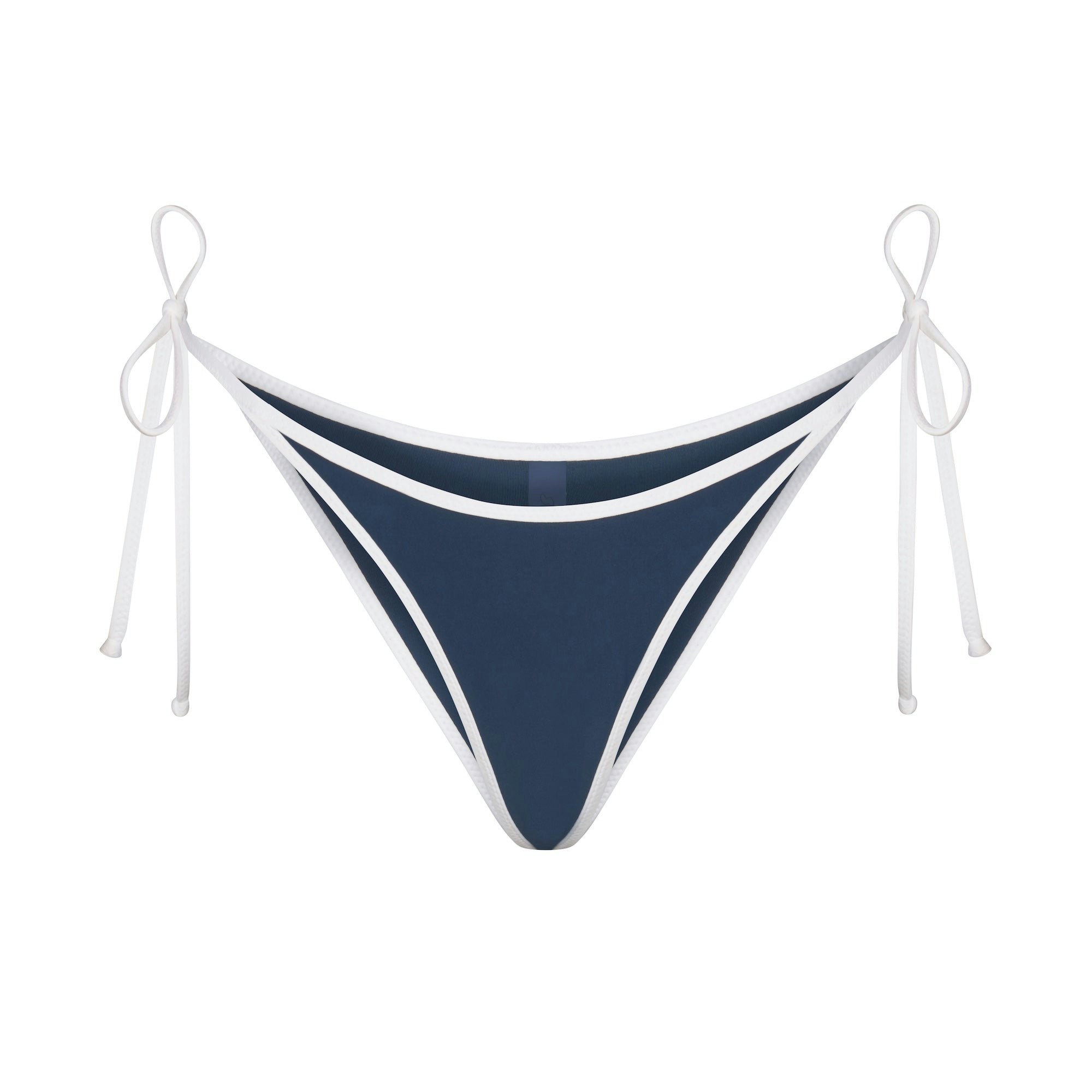SKIMS FOR TEAM USA SIGNATURE SWIM DIPPED TIE BOTTOM | NAVY (BIKINI BOTTOMS, SWIM) FLAT ON A WHITE BACKGROUND | FLT