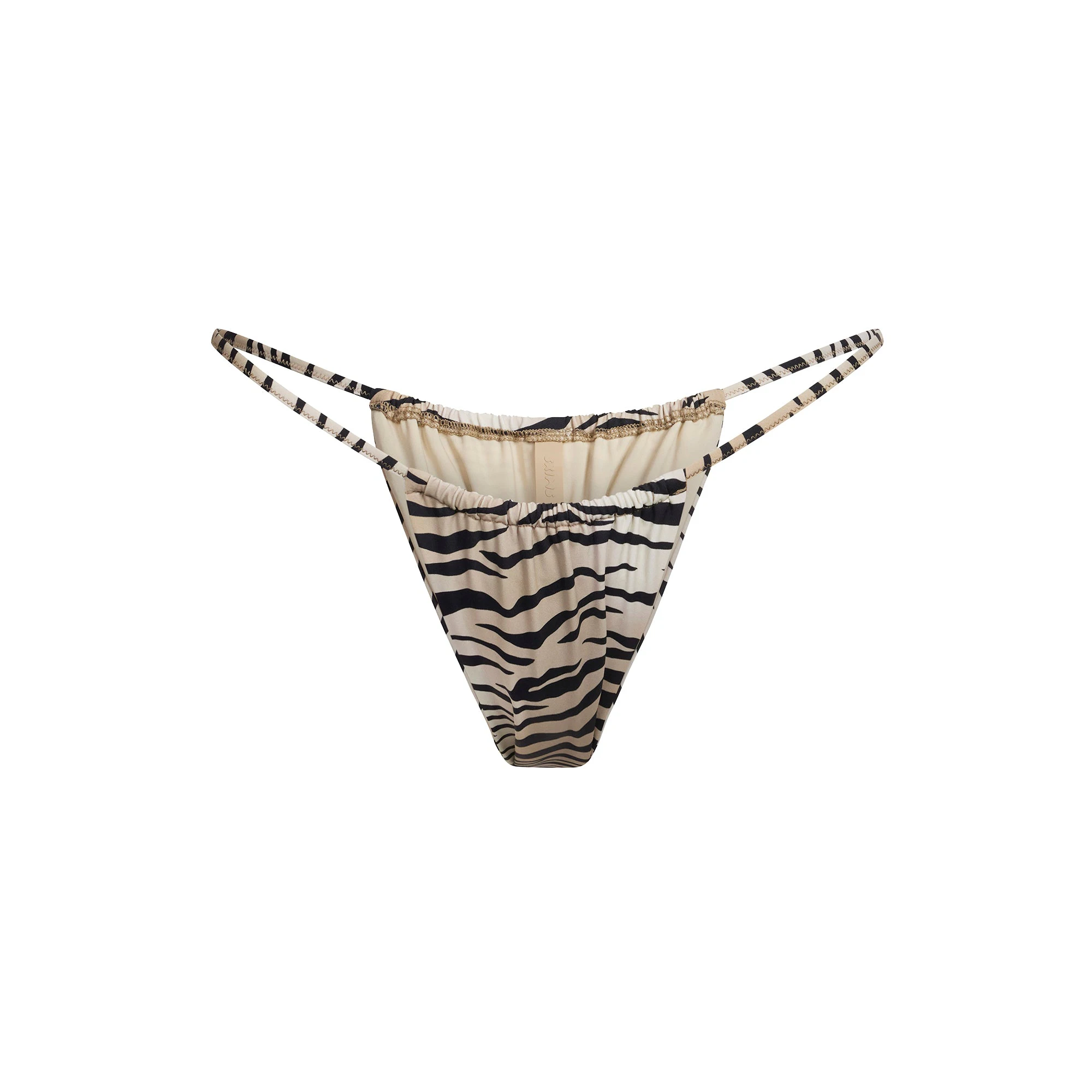 SIGNATURE SWIM STRING BIKINI BOTTOM | CHAMPAGNE TIGER PRINT FLAT ON A WHITE BACKGROUND | FLT
