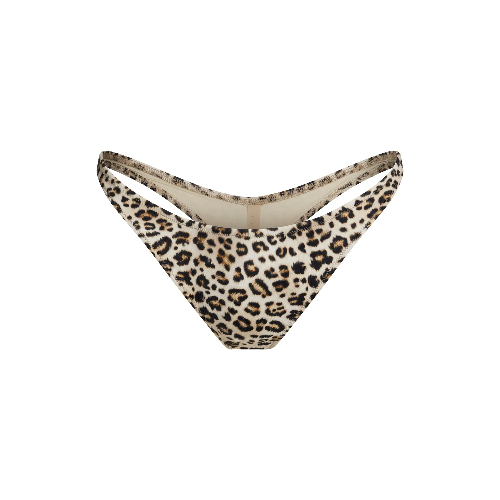 SIGNATURE SWIM THONG BIKINI BOTTOM | CHAMPAGNE LEOPARD PRINT FLAT ON A WHITE BACKGROUND | FLT